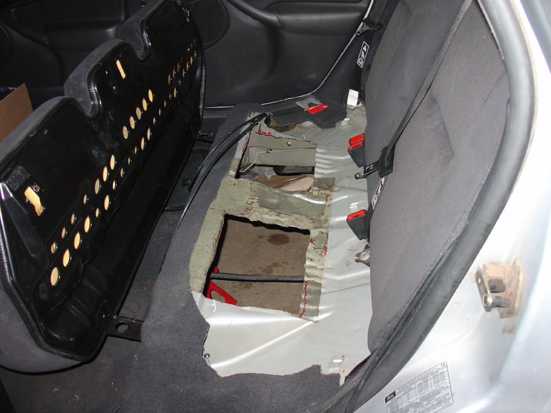 Holes under the rear seat
